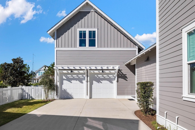 view of side of home featuring a garage