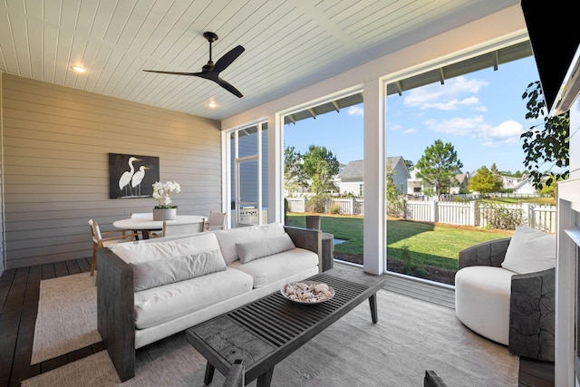 sunroom / solarium with ceiling fan