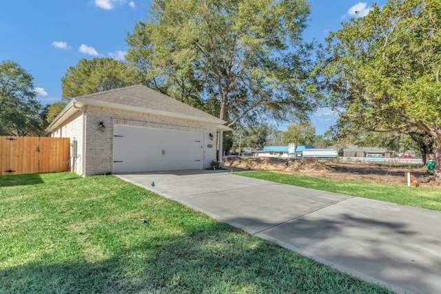 view of home's exterior with a yard and a garage