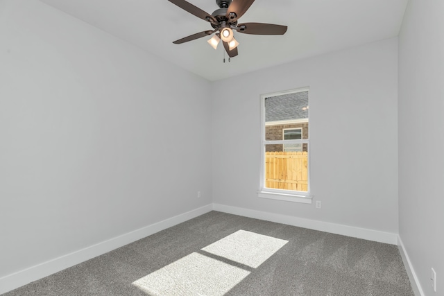 spare room featuring carpet flooring and ceiling fan