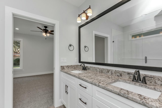 bathroom featuring ceiling fan and vanity