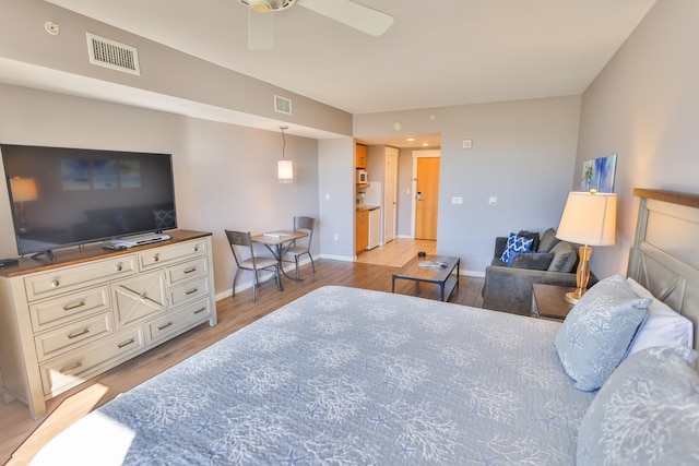 bedroom featuring ceiling fan and light wood-type flooring