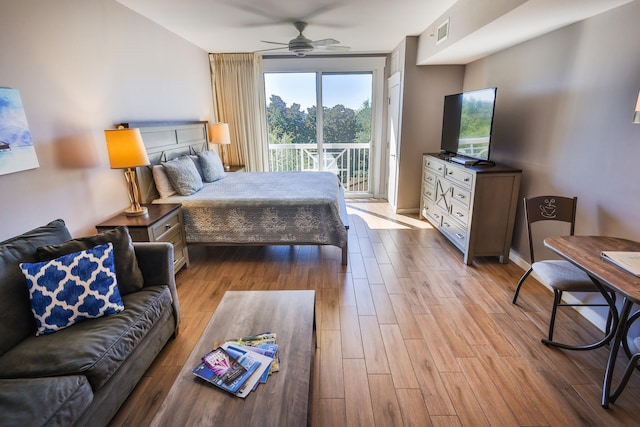 bedroom with access to outside, light hardwood / wood-style floors, and ceiling fan