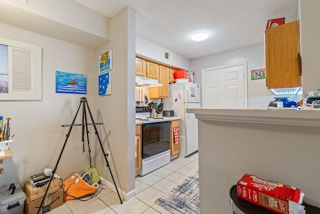 kitchen featuring a textured ceiling, kitchen peninsula, light tile patterned floors, and white appliances