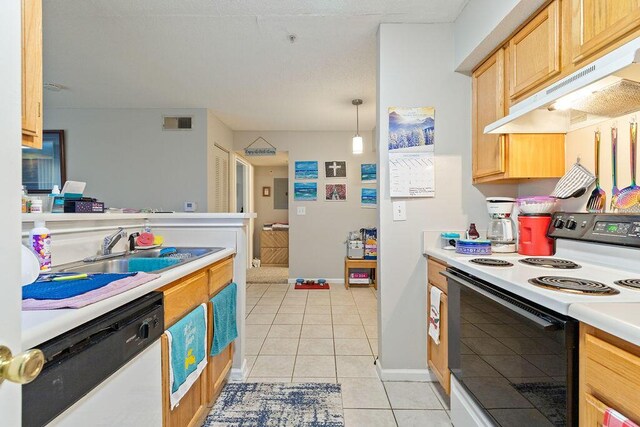 kitchen featuring white appliances, sink, exhaust hood, light tile patterned floors, and hanging light fixtures