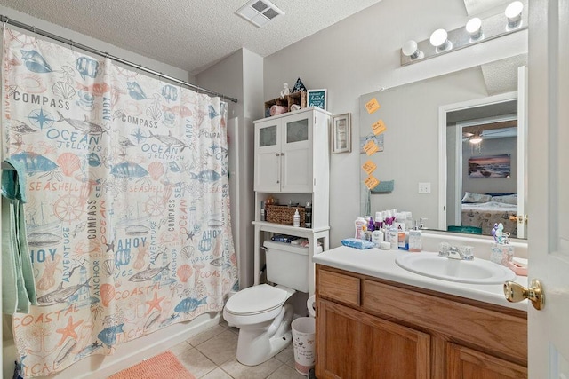 full bathroom with shower / bathtub combination with curtain, tile patterned floors, a textured ceiling, toilet, and vanity