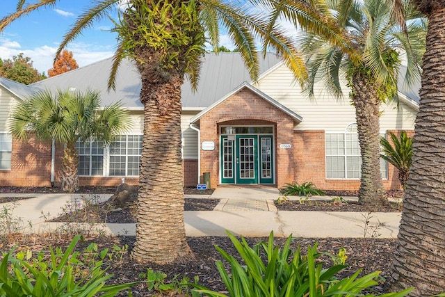 view of exterior entry featuring french doors