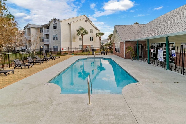 view of swimming pool with a patio