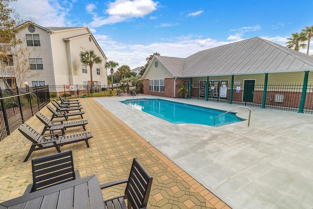 view of swimming pool with a patio