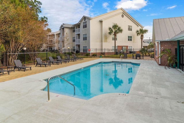 view of swimming pool with a patio