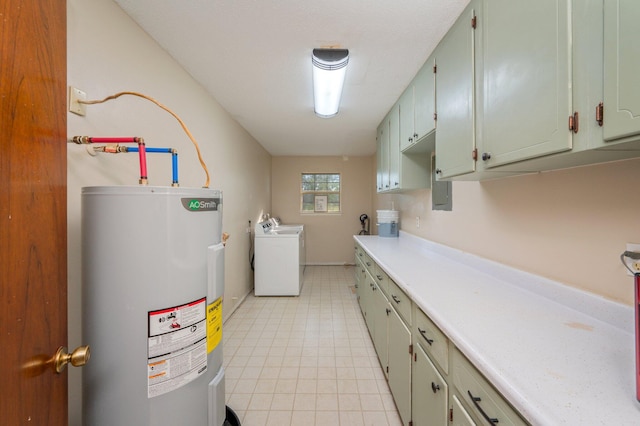 washroom with water heater, cabinets, and independent washer and dryer