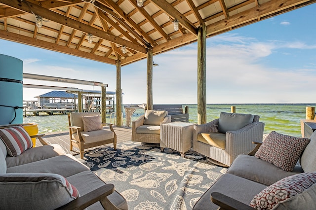 view of patio with a gazebo, a water view, and outdoor lounge area