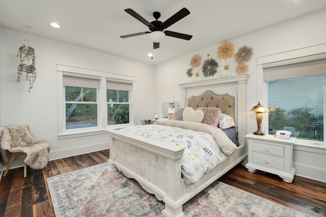 bedroom featuring ceiling fan and dark hardwood / wood-style floors