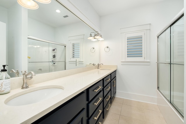 bathroom featuring shower / bath combination with glass door, vanity, and tile patterned floors