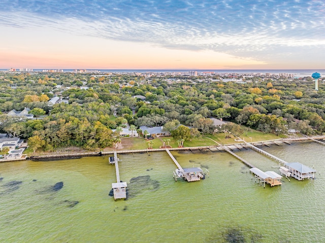 aerial view at dusk with a water view