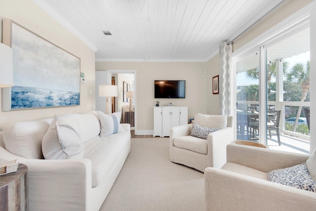 carpeted living room with ornamental molding and wooden ceiling