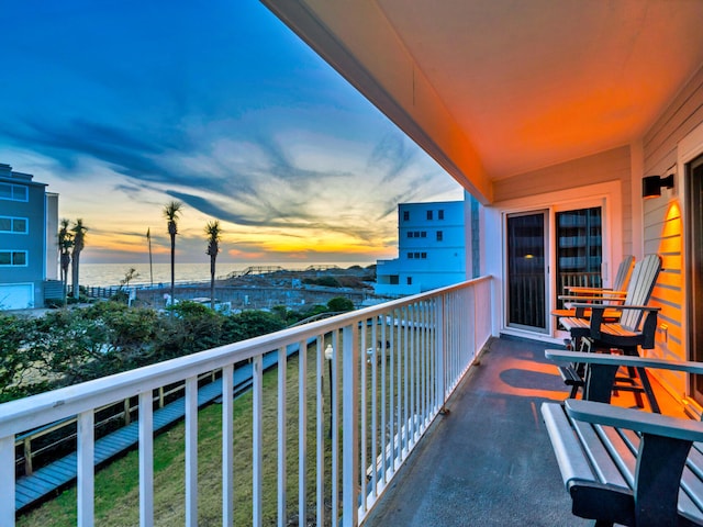 view of balcony at dusk