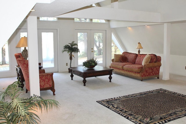 living room with carpet flooring, lofted ceiling with beams, and french doors