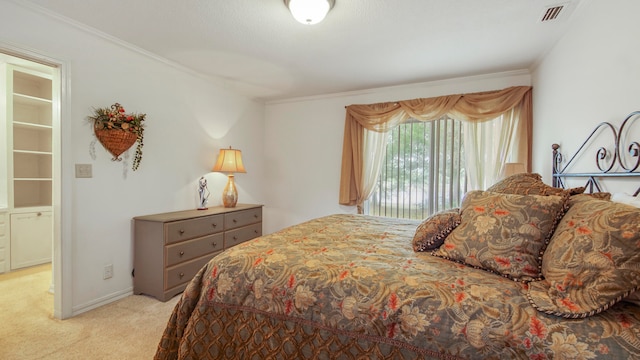 carpeted bedroom featuring crown molding