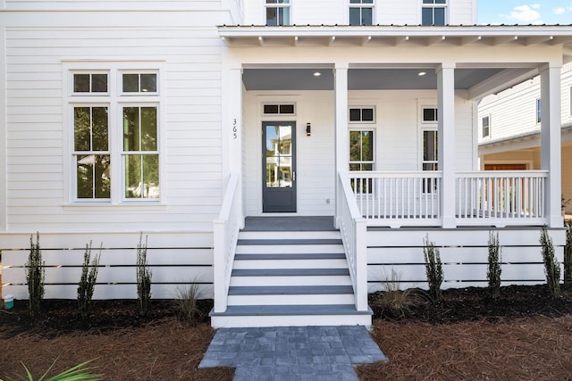 entrance to property with covered porch