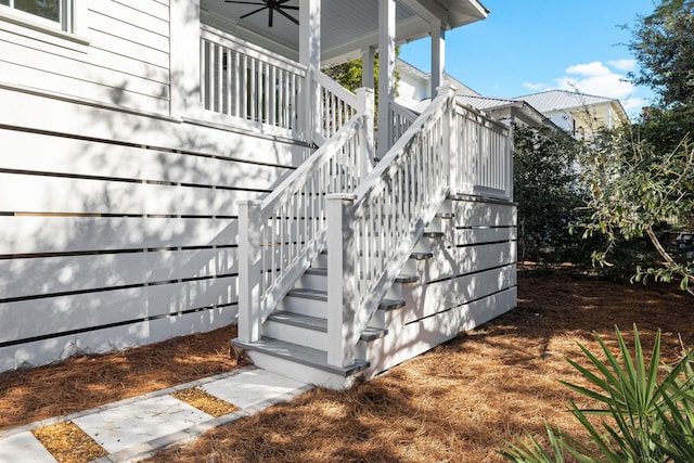 exterior space with ceiling fan