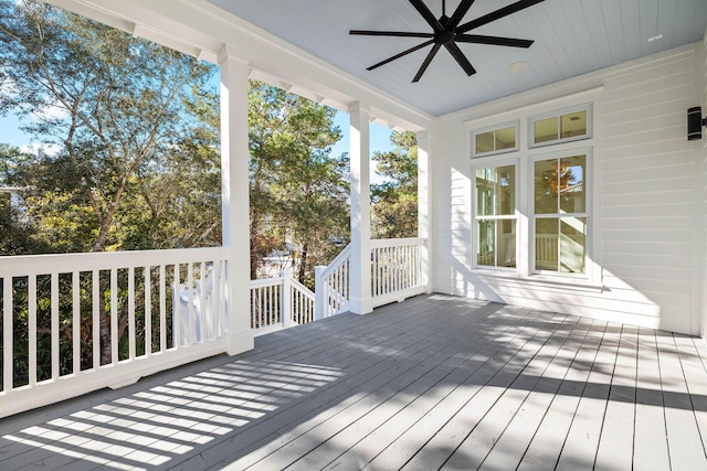 wooden deck featuring ceiling fan