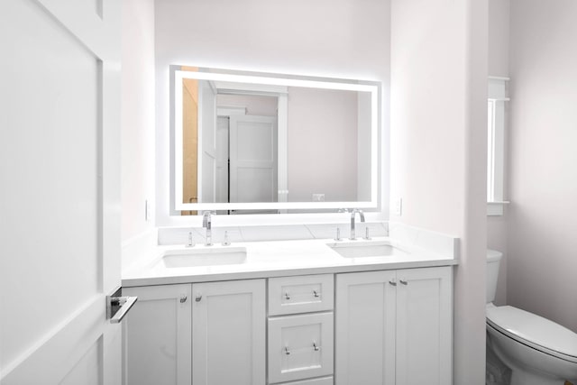 bathroom with vanity and toilet