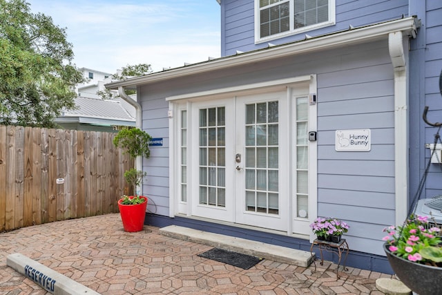 property entrance featuring french doors and a patio