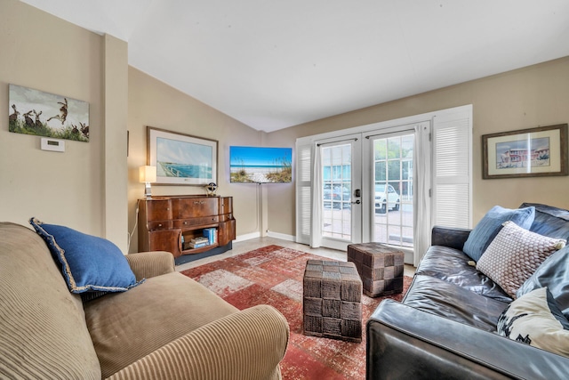 living room with french doors and lofted ceiling