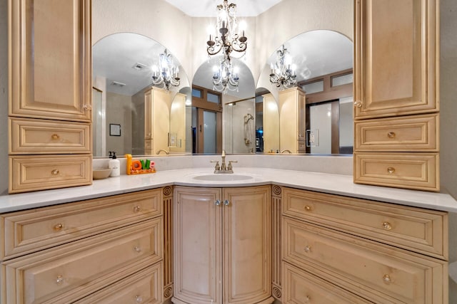 bathroom featuring vanity and a notable chandelier