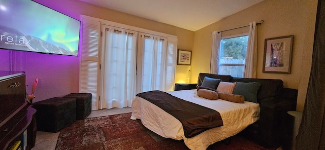 bedroom featuring vaulted ceiling