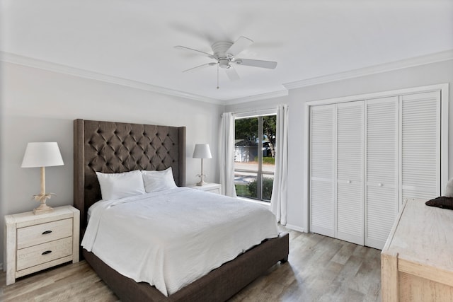 bedroom with wood-type flooring, a closet, ceiling fan, and ornamental molding