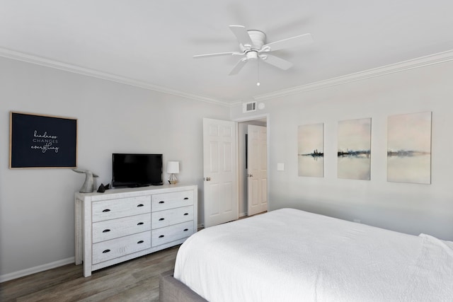 bedroom with dark hardwood / wood-style floors, ceiling fan, and ornamental molding