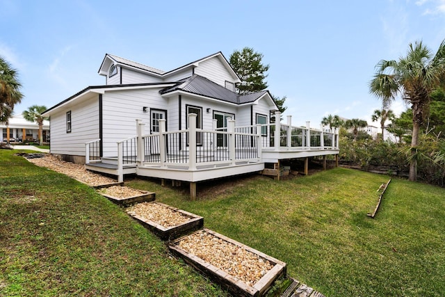 back of house with a yard and a deck