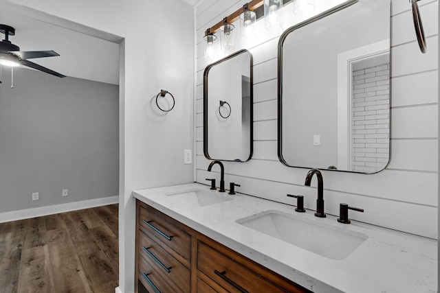 bathroom featuring vanity, hardwood / wood-style flooring, and ceiling fan