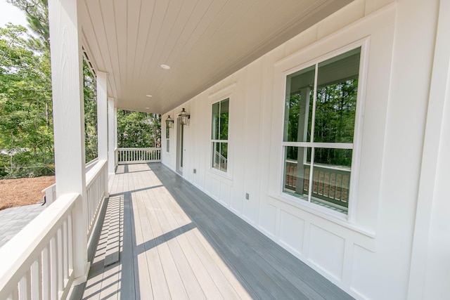 wooden terrace featuring covered porch