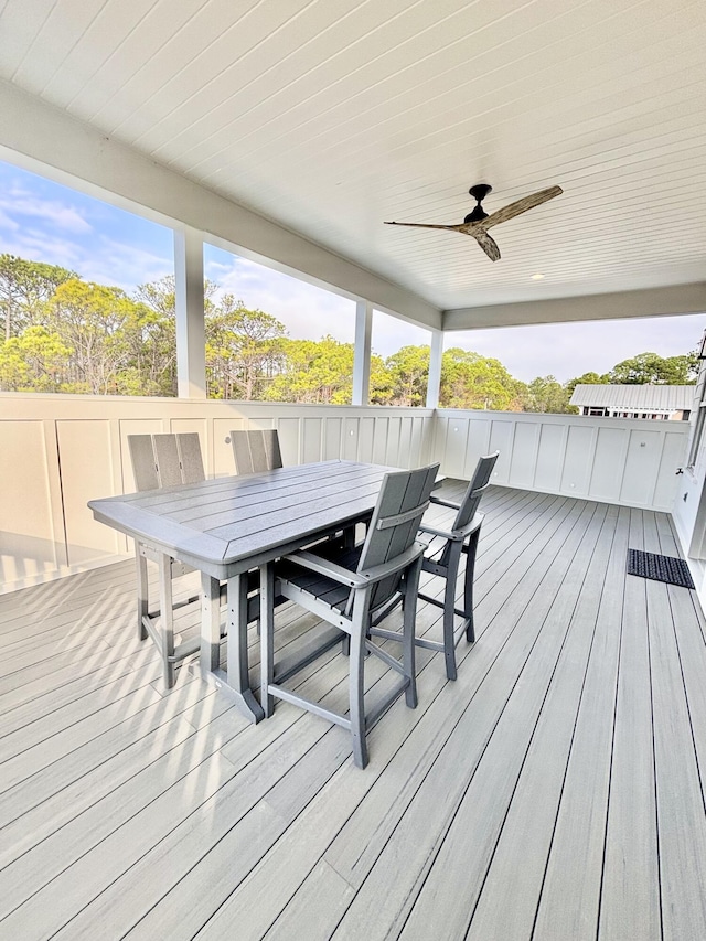 wooden terrace featuring ceiling fan