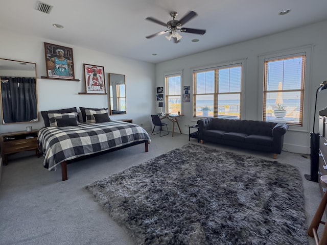 carpeted bedroom with ceiling fan