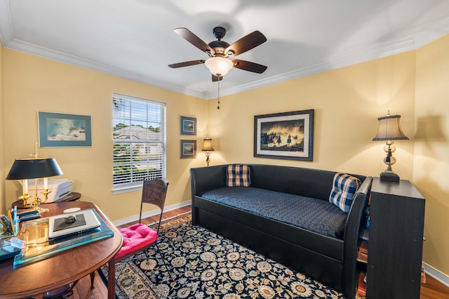 living room featuring hardwood / wood-style flooring, ceiling fan, and crown molding