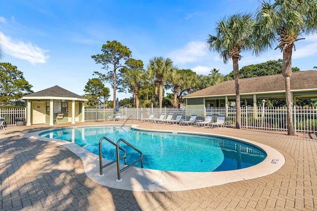 view of swimming pool featuring a patio area