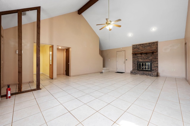 unfurnished living room with ceiling fan, a brick fireplace, beamed ceiling, high vaulted ceiling, and light tile patterned flooring