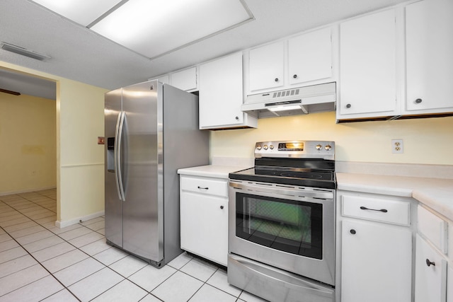 kitchen featuring white cabinetry, light tile patterned flooring, and appliances with stainless steel finishes