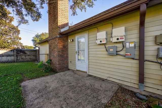 entrance to property featuring a patio