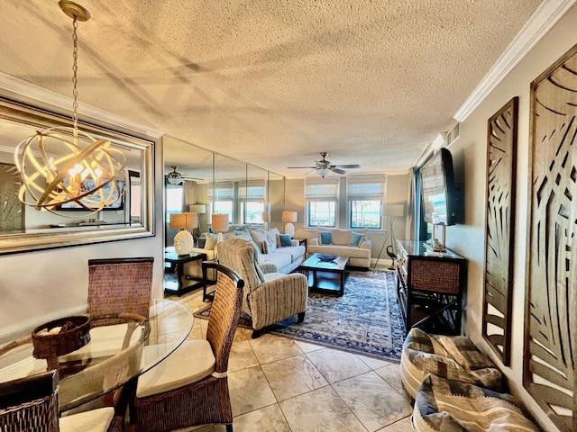 tiled living room featuring ceiling fan with notable chandelier, a textured ceiling, and ornamental molding