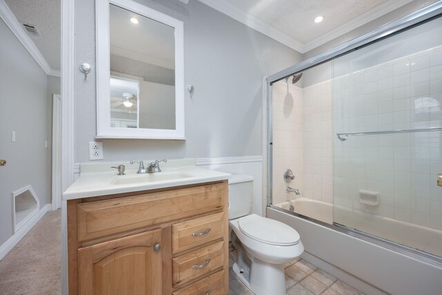 full bathroom with vanity, crown molding, bath / shower combo with glass door, toilet, and a textured ceiling