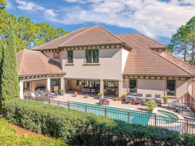 rear view of property featuring a patio