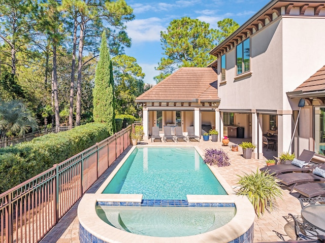 view of swimming pool with a patio