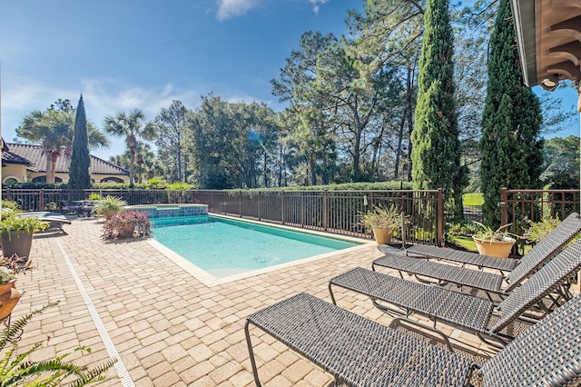 view of swimming pool with a patio area