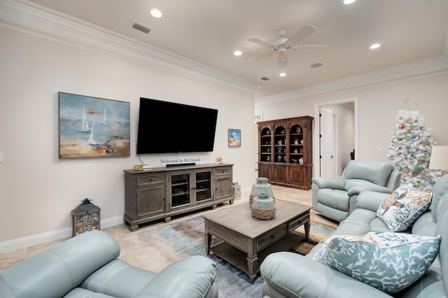 tiled living room featuring ceiling fan and ornamental molding