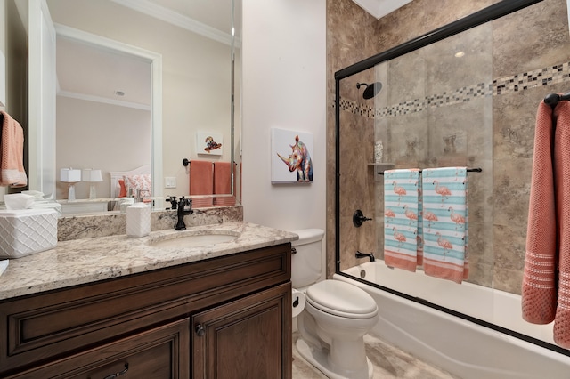 full bathroom with combined bath / shower with glass door, vanity, toilet, and crown molding